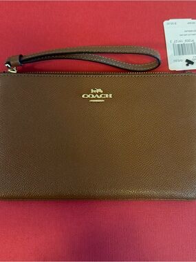 Coach Brown Leather Wristlet with Gold Logo Accent